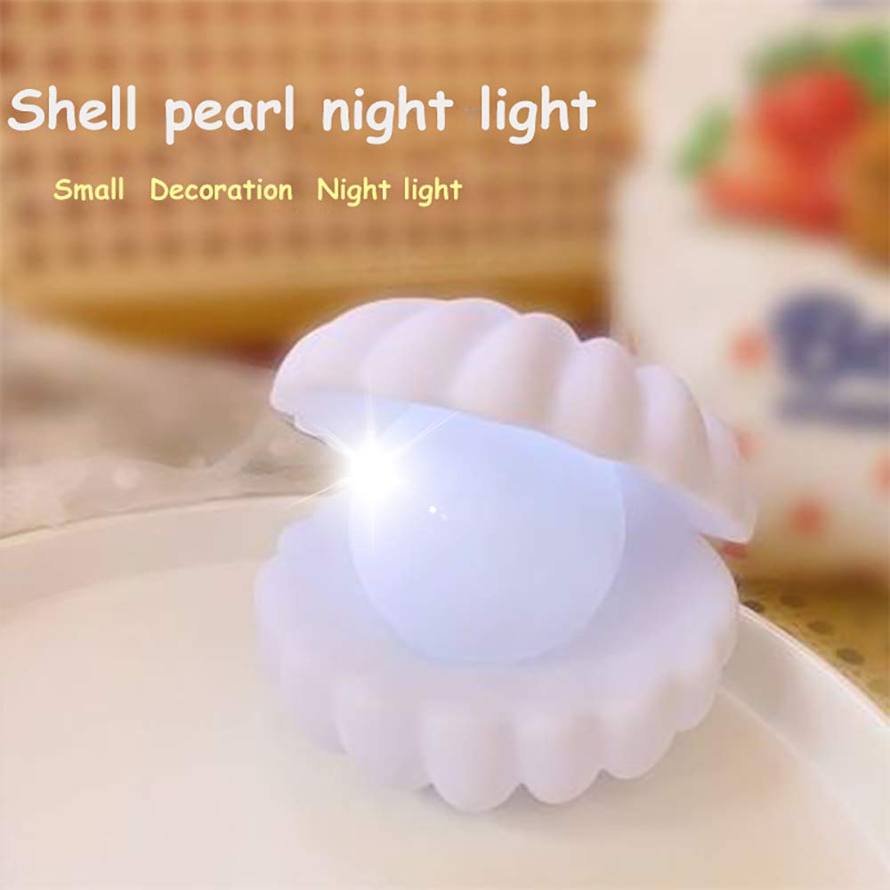 Shell-shaped night light with a soft glow on a blurred background