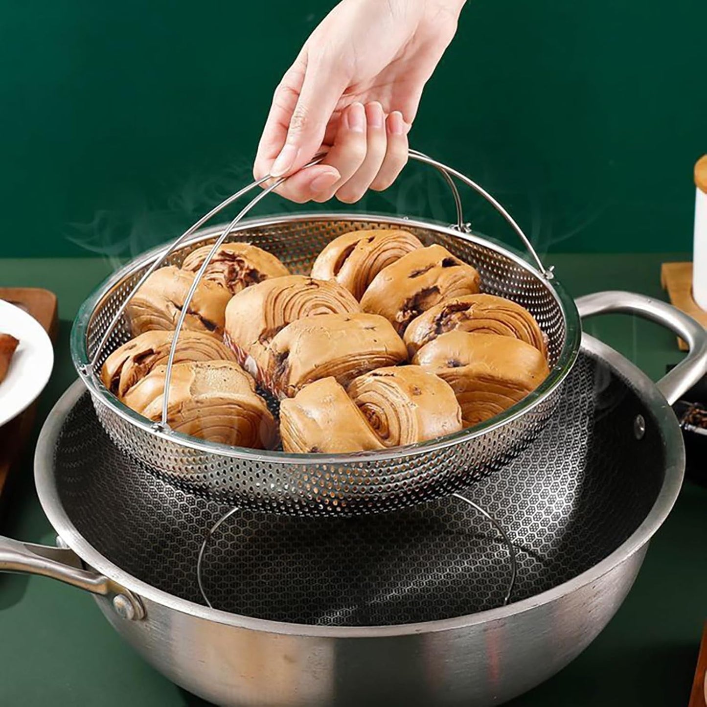 Stainless steel steamer basket with foldable design, anti-hot handle, and heat-resistant grips – perfect for veggies, dumplings, and seafood.