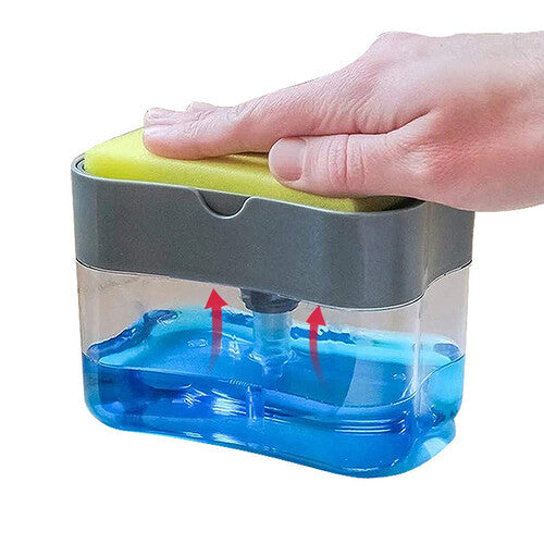 Kitchen soap pump and sponge caddy in use, dispensing dish soap with sponge on top – clean and compact sink solution.

