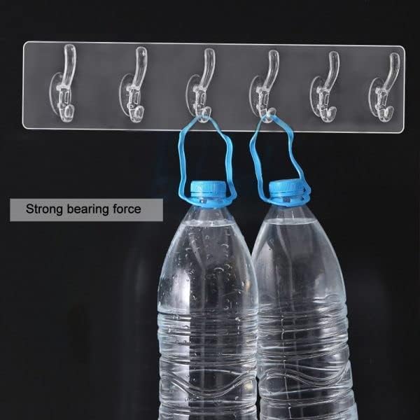 Clear wall hook holding two water bottles with blue caps against a black background