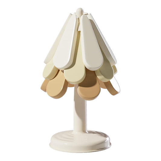 Tree-shaped silicone trivet set with stand in a modern kitchen setting

