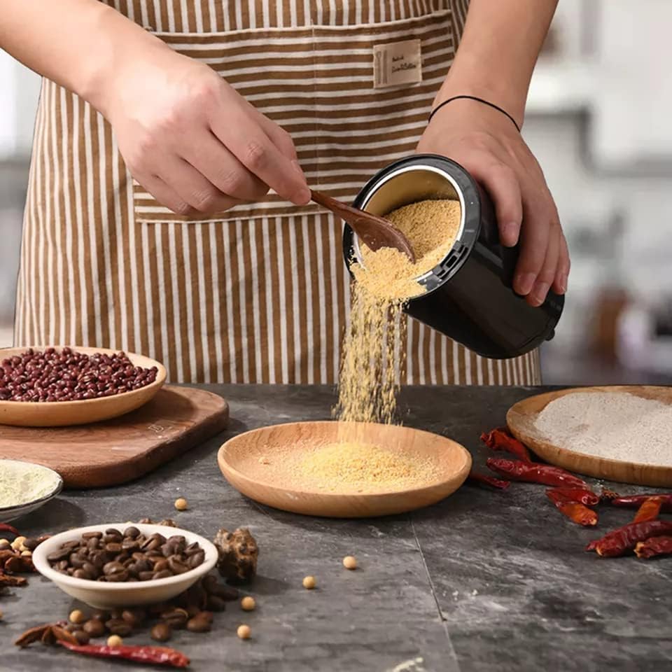 Electric coffee and spice grinder in stainless steel with removable bowl – compact and multi-functional kitchen appliance for masalas, beans, and herbs.