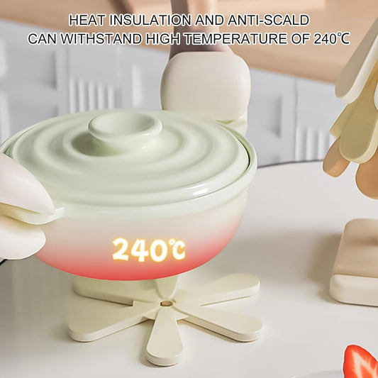 Tree-shaped silicone trivet set with stand in a modern kitchen setting


