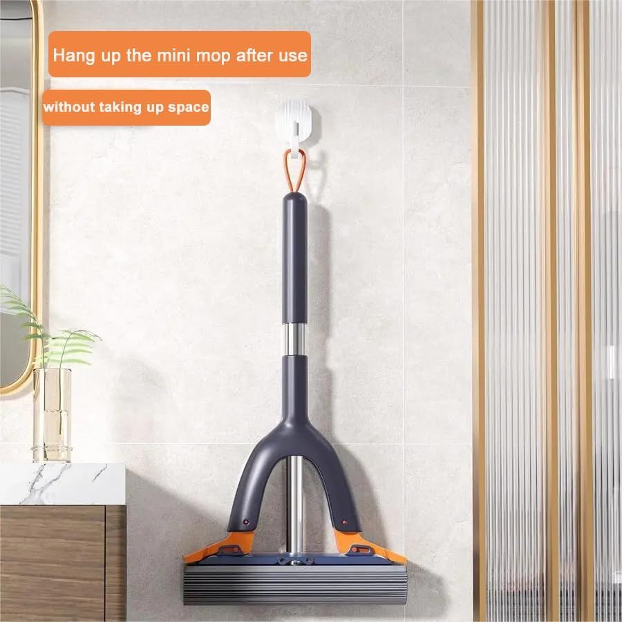 Mini mop hanging on a wall-mounted holder with text instructions.