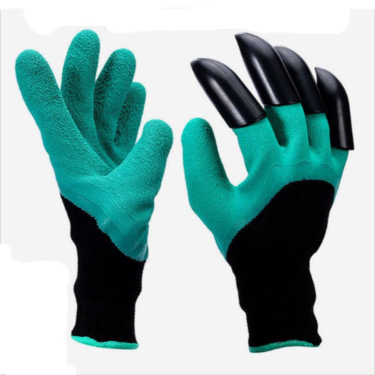 Pair of green gardening gloves with black claws on a white background