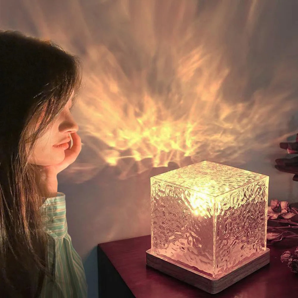 Person looking at a glowing crystal cube on a table with a warm light