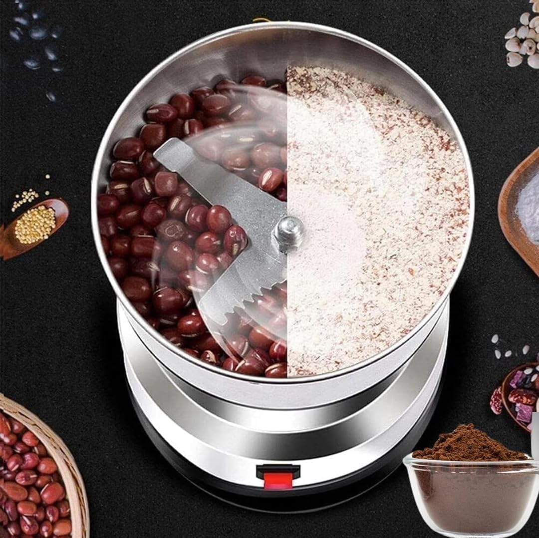 Coffee grinder with coffee beans and ground coffee on a black background