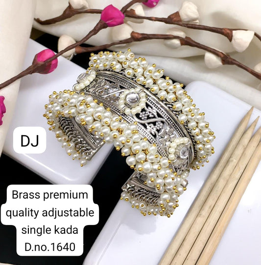 Brass premium quality adjustable single kada with pearls on a white surface.